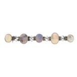 An Arts and Crafts silver opal bar brooch.