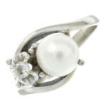 A cultured pearl and diamond ring.Stamped 750.Ring size O.