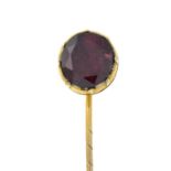 A 19th century garnet stickpin.Length of stick pin head 1cms.