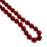 Two red bakelite bead necklaces.
