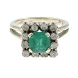 A synthetic emerald and paste cluster ring.Stamped 950.Ring size M1/2.
