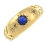 A sapphire and diamond gypsy-set ring.Ring size O.