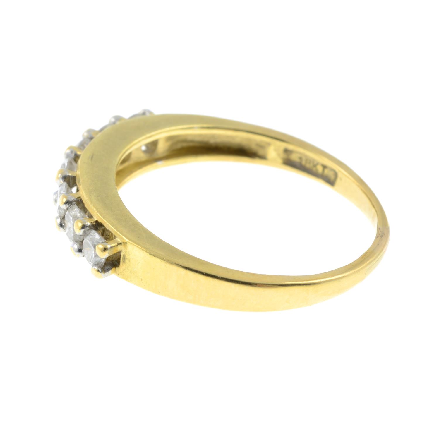 An 18ct gold seven stone diamond ring.Total diamond weight 0.50cts, stamped to band. - Image 2 of 3