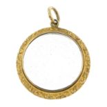 A late 19th century 9ct gold glazed locket pendant.Length 3.8cms.