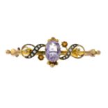 An Edwardian 9ct gold amethyst and split pearl brooch.Hallmarks for Chester, 1909.Length 5cms.