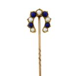 An early 20th century gold lapis lazuli and split pearl horseshoe stickpin.Length of stickpin head