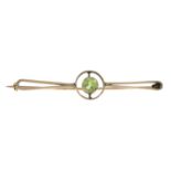 An early 20th century 9ct gold peridot brooch and two cultured pearl stickpins.Brooch stamped