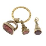 Three late Victorian carnelian fobs suspended on an engraved key ring.Length 2 to 2.5cms.