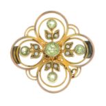 An early 20th century 9ct gold peridot and seed pearl openwork brooch.Length 2.6cms.