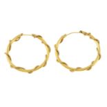 A pair of 14ct gold fancy hoop earrings.Length 3.3cms.