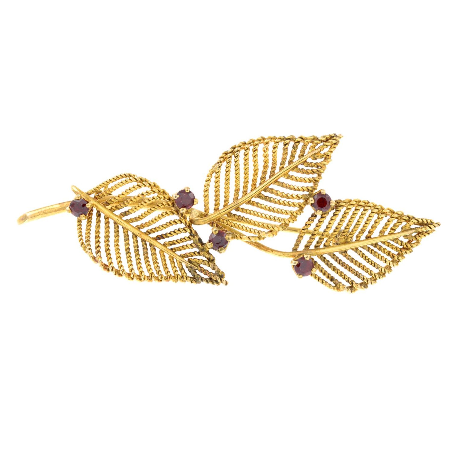 A garnet set leaf design brooch, by Zeeta.Signed Zeeta.