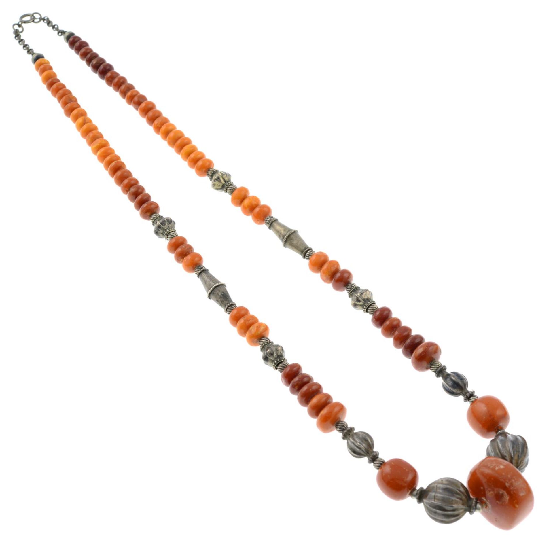 An amber and white metal bead necklace.Length 69cms. - Image 2 of 2