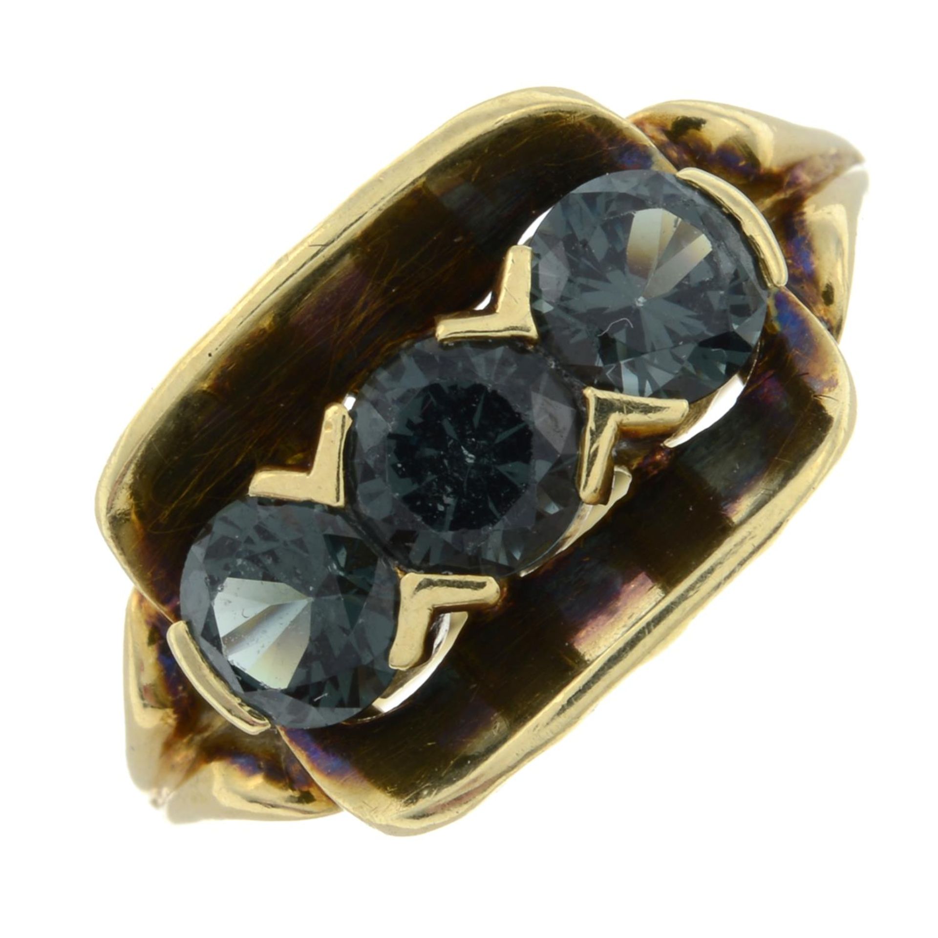 A synthetic spinel three stone ring.Stamped 585.Ring size N.