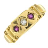 An early 20th century 18ct gold old-cut diamond and ruby three-stone ring.Ring size N1/2.