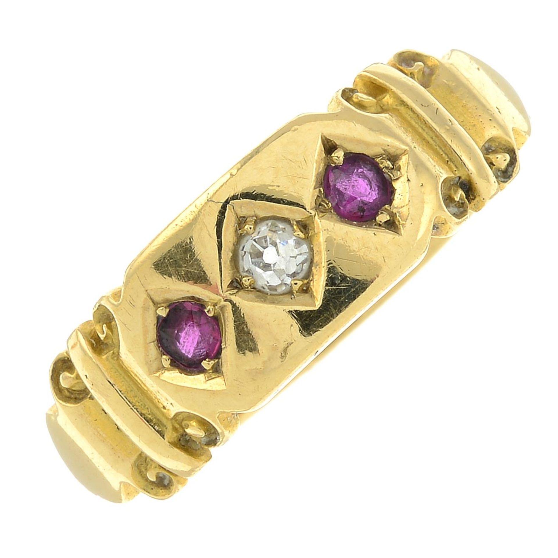 An early 20th century 18ct gold old-cut diamond and ruby three-stone ring.Ring size N1/2.