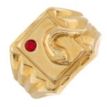 An 18ct gold snake signet ring with red paste accent.Italian marks for 18ct gold.
