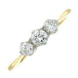 An 18ct gold diamond three-stone ring.Estimated total diamond weight 0.26cts.Stamped 18ct PT.Ring