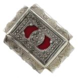 A tribal dress ring, with red enamel accents.Ring size Q1/2.