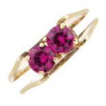 A synthetic ruby two-stone ring.Stamped 585.Ring size N1/2.