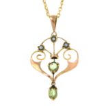 An early 20th century 9ct gold peridot and split pearl pendant,