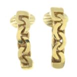 A pair of curb-link chain motif half-hoop earrings.