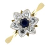An 18ct gold diamond and sapphire ring.Estimated total diamond weight 0.12cts.Hallmarks for