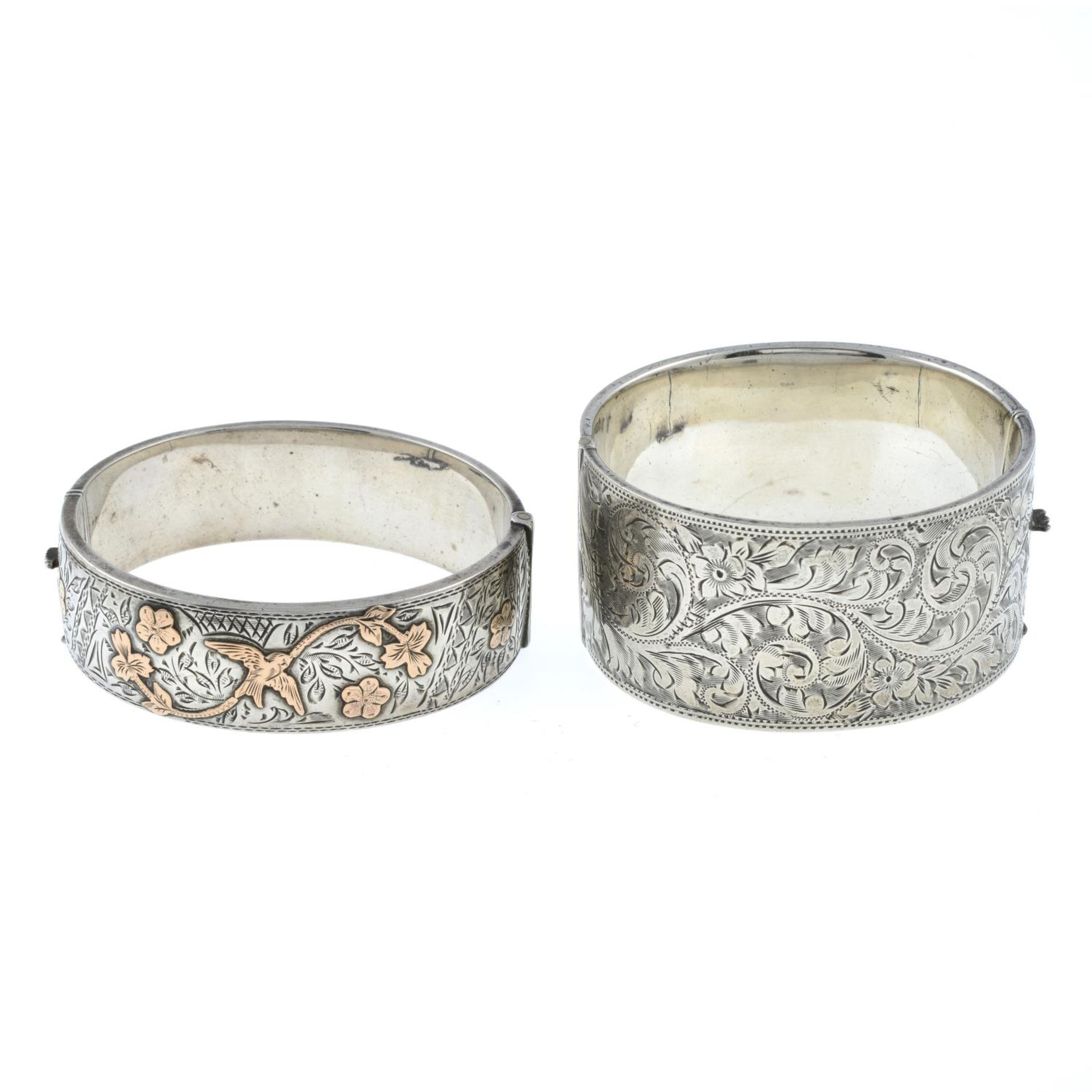 A silver engraved bangle with bird appliqué,