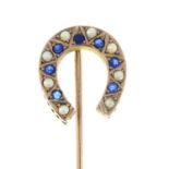 An early 20th century sapphire and split pearl horseshoe stickpin.Length of stickpin head 1.7cms.