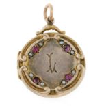 An early 20th century garnet and split pearl locket.Length 3.8cms.