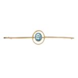 An early 20th century 9ct gold blue paste bar brooch.Stamped 9ct.Length 7.4cms.