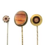 Three gem-set stickpins,