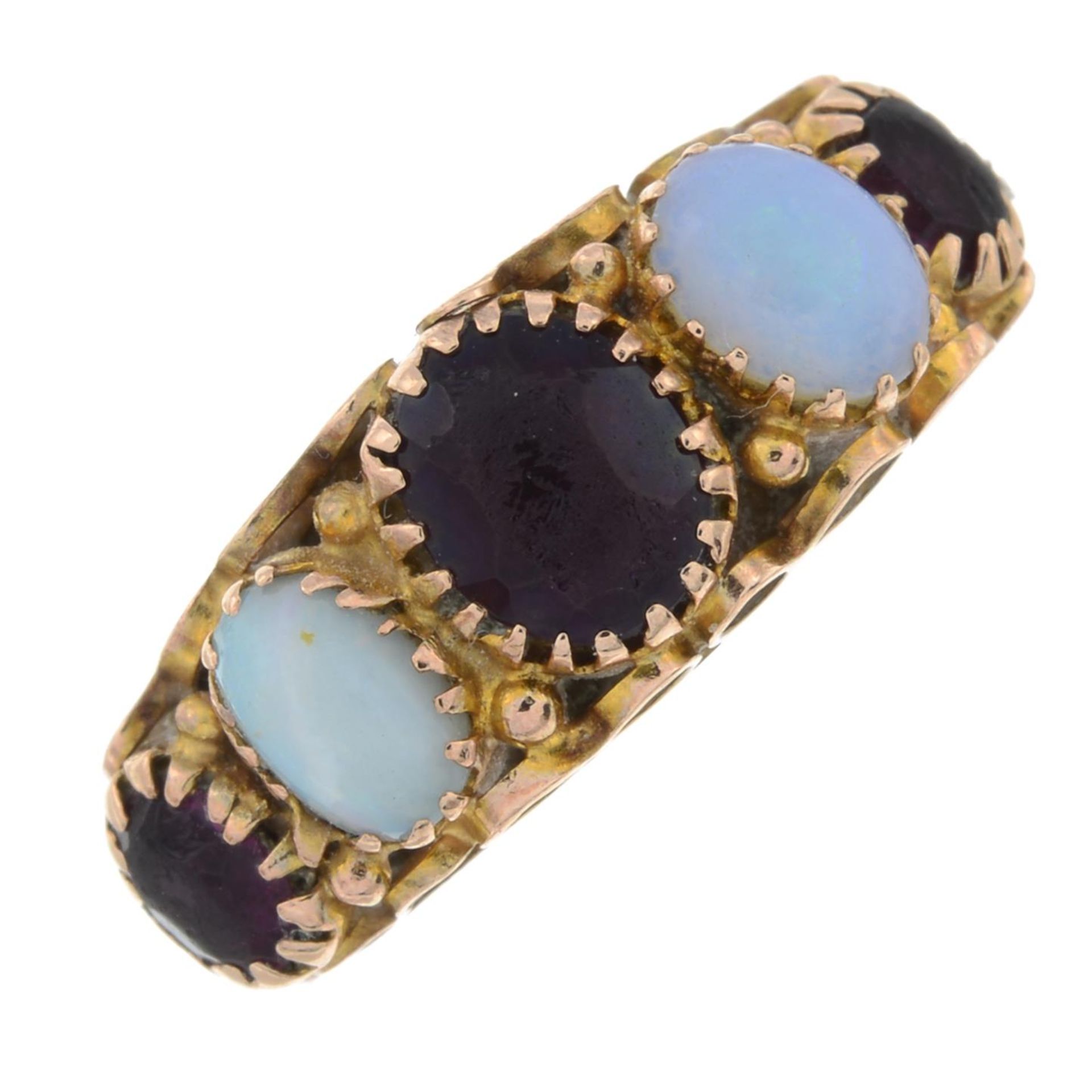 An early 20th century garnet and opal ring.Stamped 375.Ring size F.