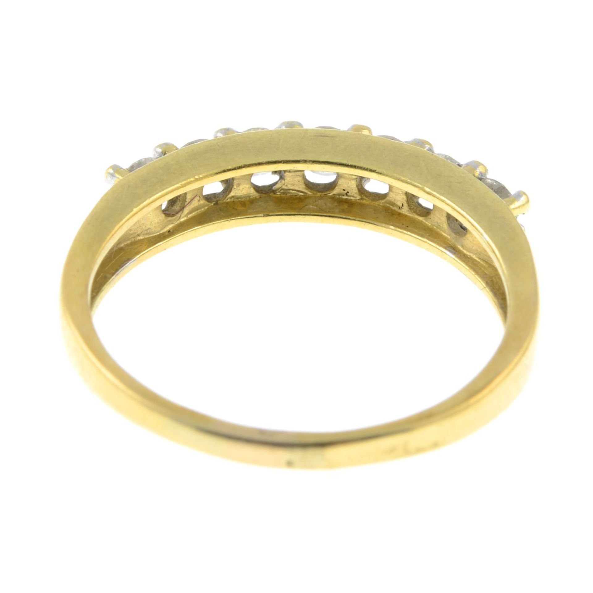An 18ct gold seven stone diamond ring.Total diamond weight 0.50cts, stamped to band. - Image 3 of 3