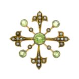 An early 20th century 9ct gold peridot and split pearl brooch.Stamped 9ct.Length 3.3cms.