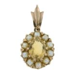 An early 20th century 9ct gold citrine and seed pearl pendant.Stamped 9t.Length 2.8cms.
