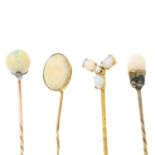 Four opal and diamond stickpins.One stamped 9ct.Lengths of stickpin heads 1.1 to 1.3cms.