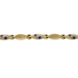 A synthetic ruby, synthetic sapphire and colourless gem bracelet.Length 19.3cms.