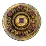 An 18ct gold Etruscan revival garnet reverse locket brooch.Length 3.5cms.