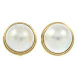 A pair of 9ct gold mabe pearl earrings.Hallmarks for Sheffield.Length 1.7cms.