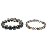 A cats-eye chrysoberyl line bracelet and a multi-gem set bracelet.Lengths 18.5cms.