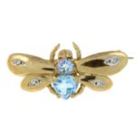 A 9ct gold blue topaz and diamond brooch of a bee.Hallmarks for Birmingham, 2000.Length 3cms.