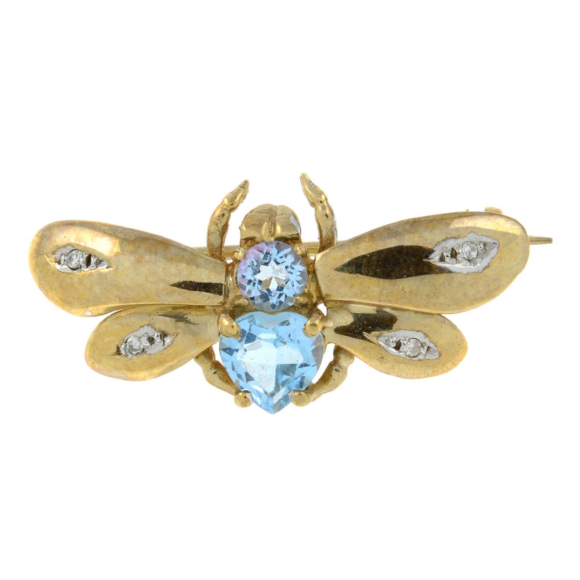 A 9ct gold blue topaz and diamond brooch of a bee.Hallmarks for Birmingham, 2000.Length 3cms.