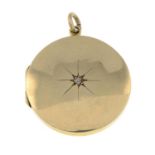An early 20th century 9ct gold circular locket pendant, with diamond star highlight.