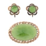 A jade brooch and a pair of jade earrings.