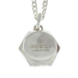 A silver hexagonal tag pendant with curb chain, by Gucci.Signed Gucci.