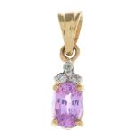 A pink sapphire and diamond pendant.Stamped 375.Length 1.5cms.