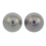 A pair of 18ct gold pearl stud earrings.Hallmarks for Birmingham.Length 0.9cms.