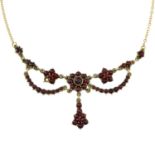 A bohemian garnet floral necklace.Stamped 9ct.Length 42cms.