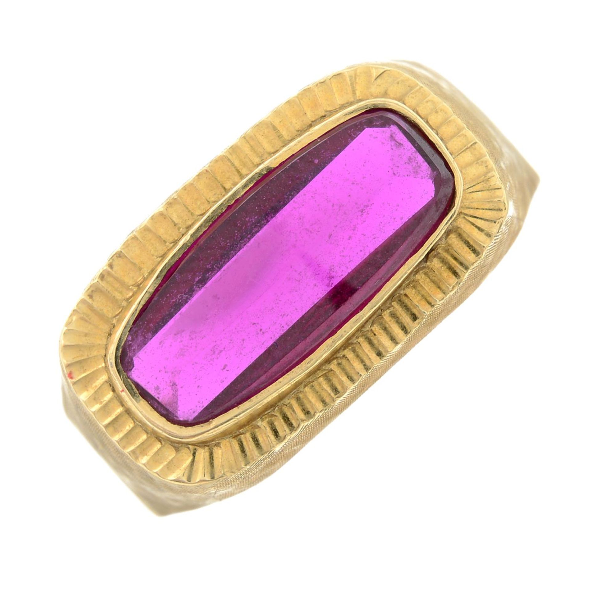 A synthetic ruby dress ring.