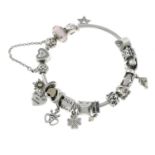 A bangle with assorted charm, by Pandora.Signed Pandora.